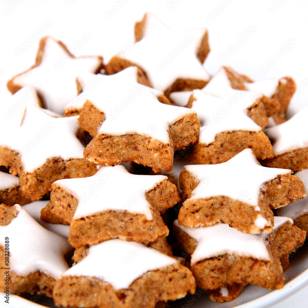 Plate of christmas star shaped cookies with white icing
