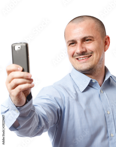 Businessman taking photos with cellphone