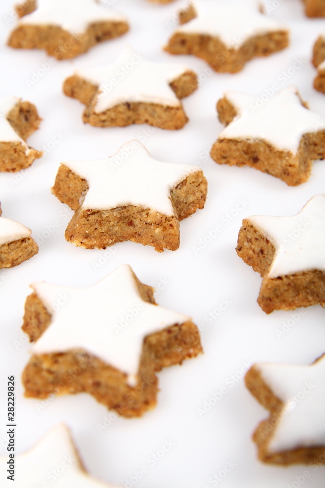 Christmas star shaped cookies with white icing on white Christmas star shaped cookies with white icing on white