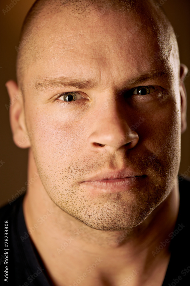 Obraz premium Closeup portrait of a serious handsome young man