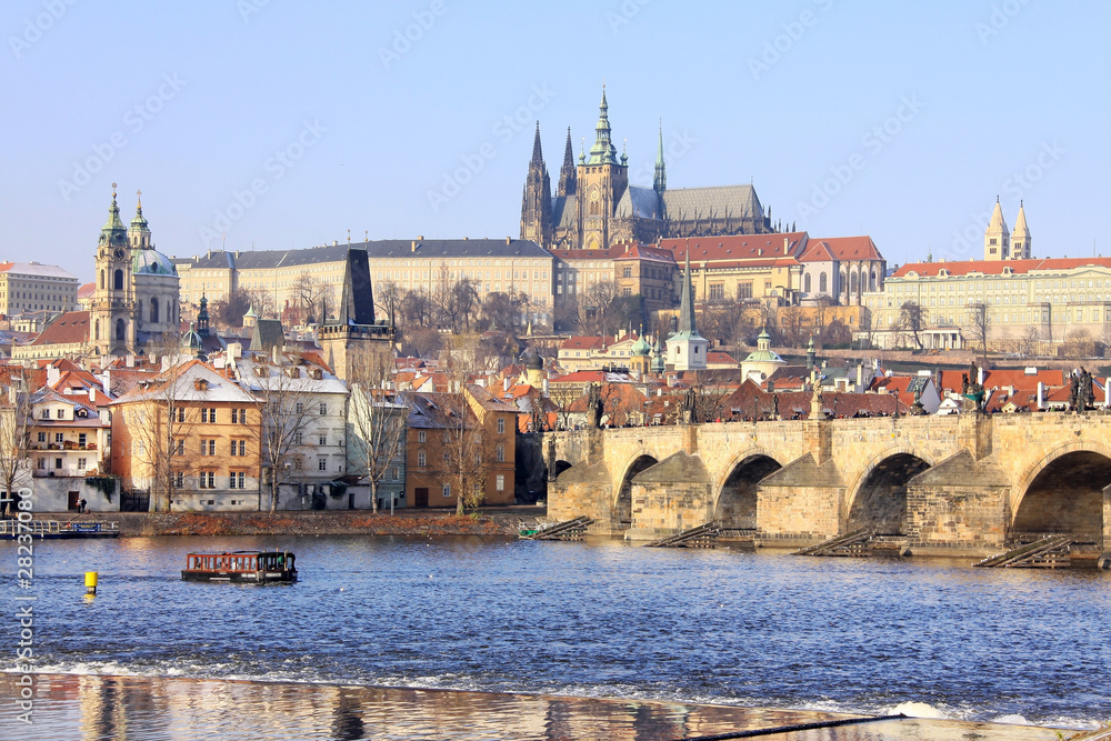 First Snow in Prague, gothic Castle with the Charles Bridge
