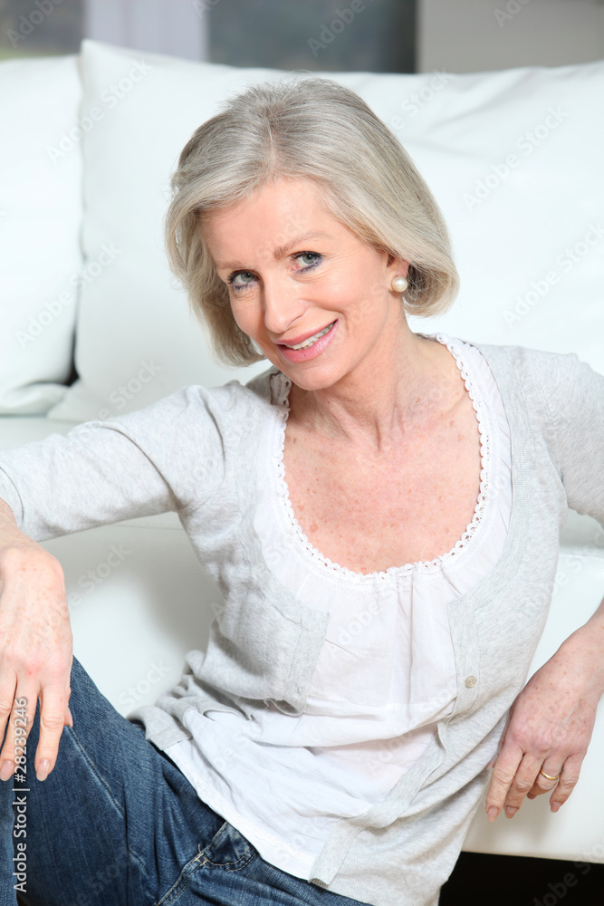 Closeup of smiling senior woman relaxing at home Closeup of smiling senior woman relaxing at home