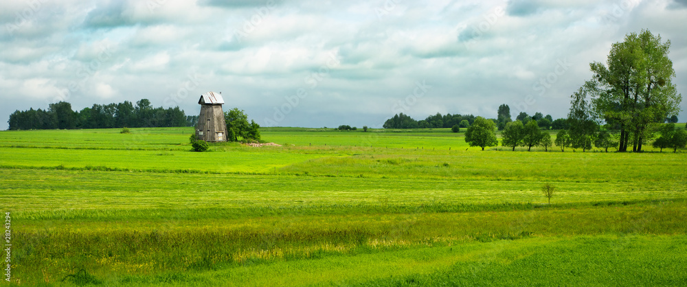 Obraz premium Spring panorama with old windmill