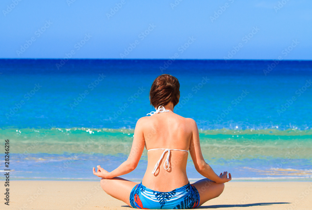 Meditating on the sunny beach
