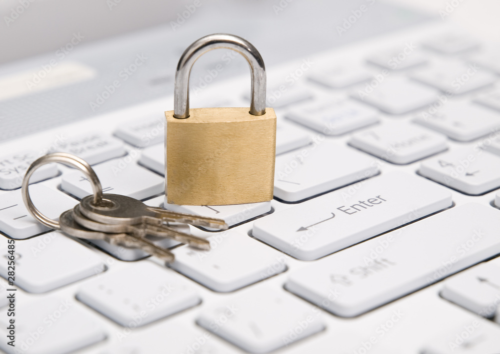 Padlock on white keyboard. Security concept. Padlock on white keyboard. Security concept.