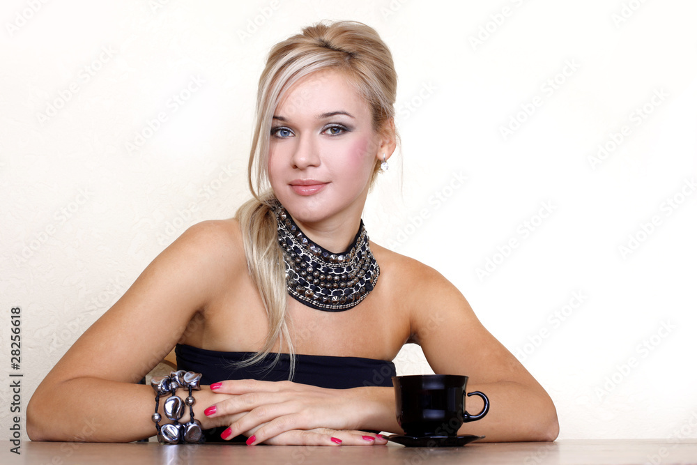 woman with cup of hot drink against yellow wall at home woman with cup of hot drink against yellow wall at home