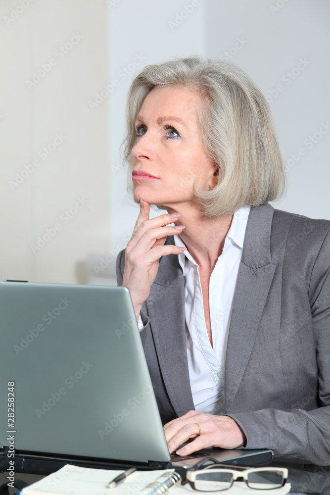 Senior businesswoman working in the office Senior businesswoman working in the office