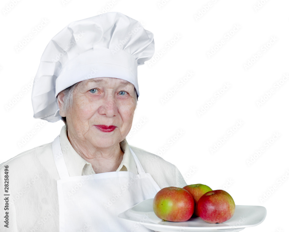 Senior woman in chef hat isolated on white Senior woman in chef hat isolated on white