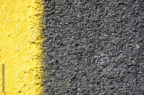 asphalt road with yellow paint