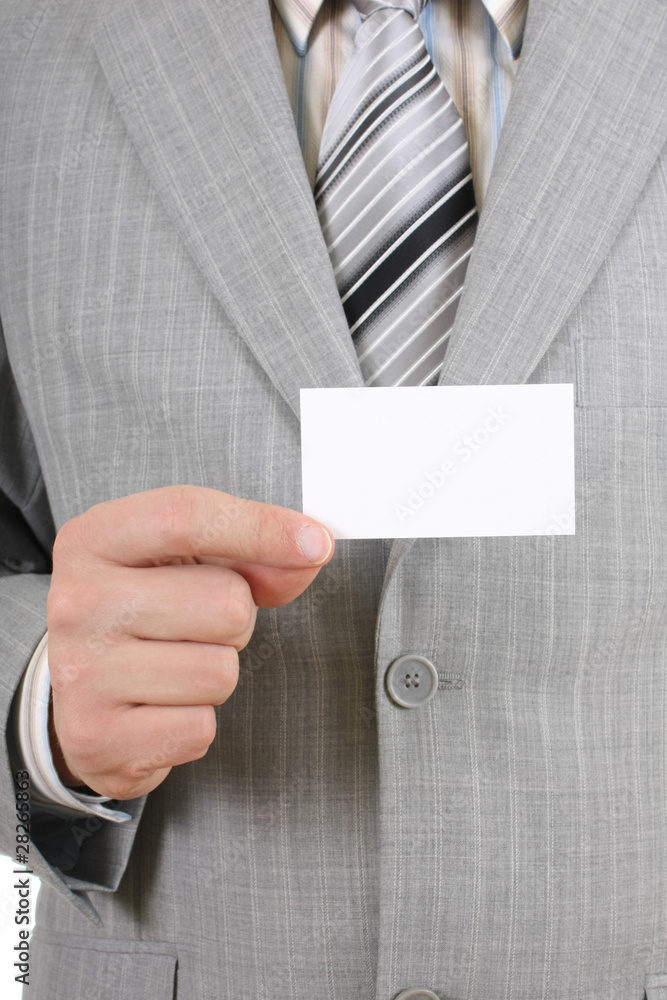Young businessman showing a blank business card Young businessman showing a blank business card