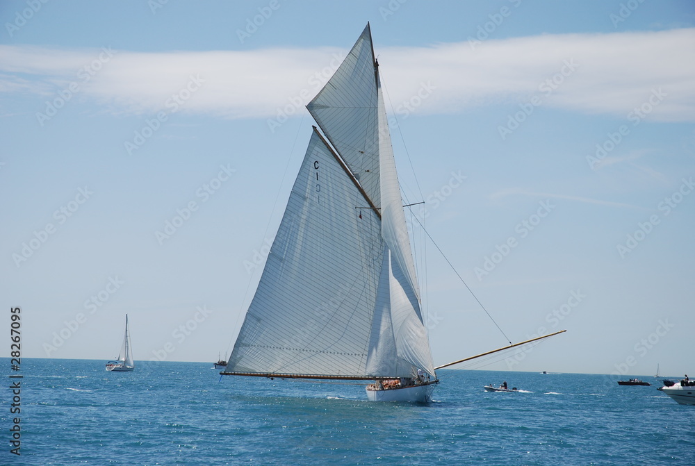 classic wood sailing yacht in regatta