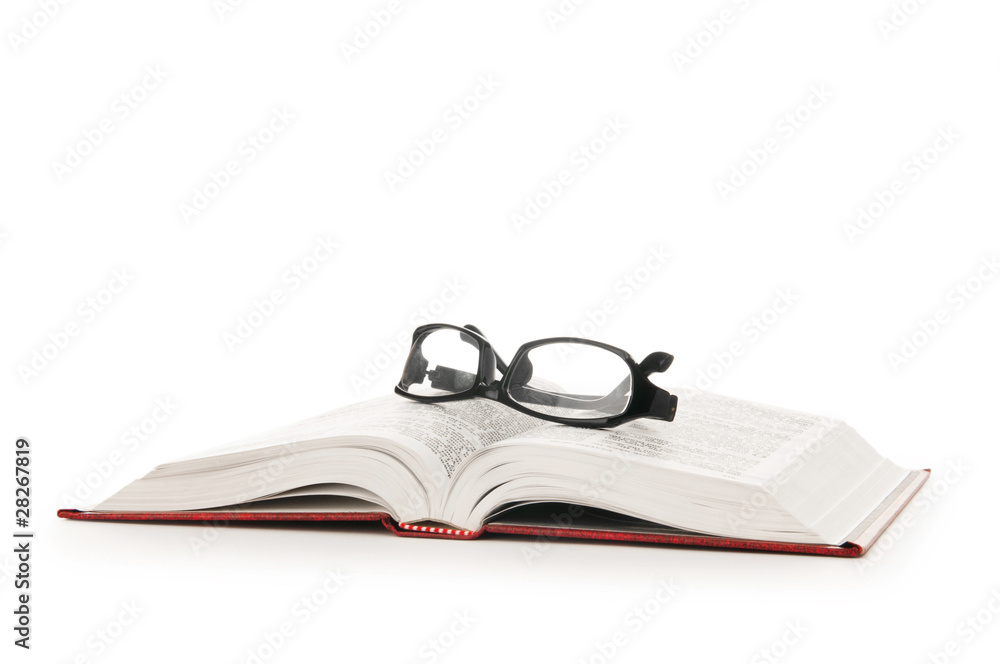 Reading glasses with books isolated on the white Reading glasses with books isolated on the white
