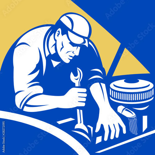 Mechanic working on car engine