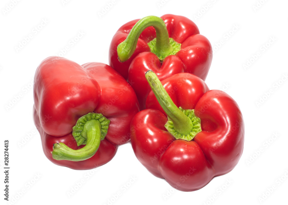 Three red sweet peppers isolated on white