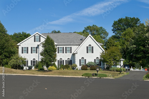 Front of Large Single Family Home Street Pennsylvania Blue Sky © qingwa
