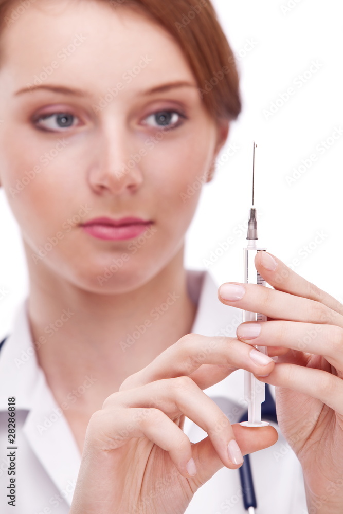 Doctor holds on syringe. Macro shoot of syringe. Doctor holds on syringe. Macro shoot of syringe.