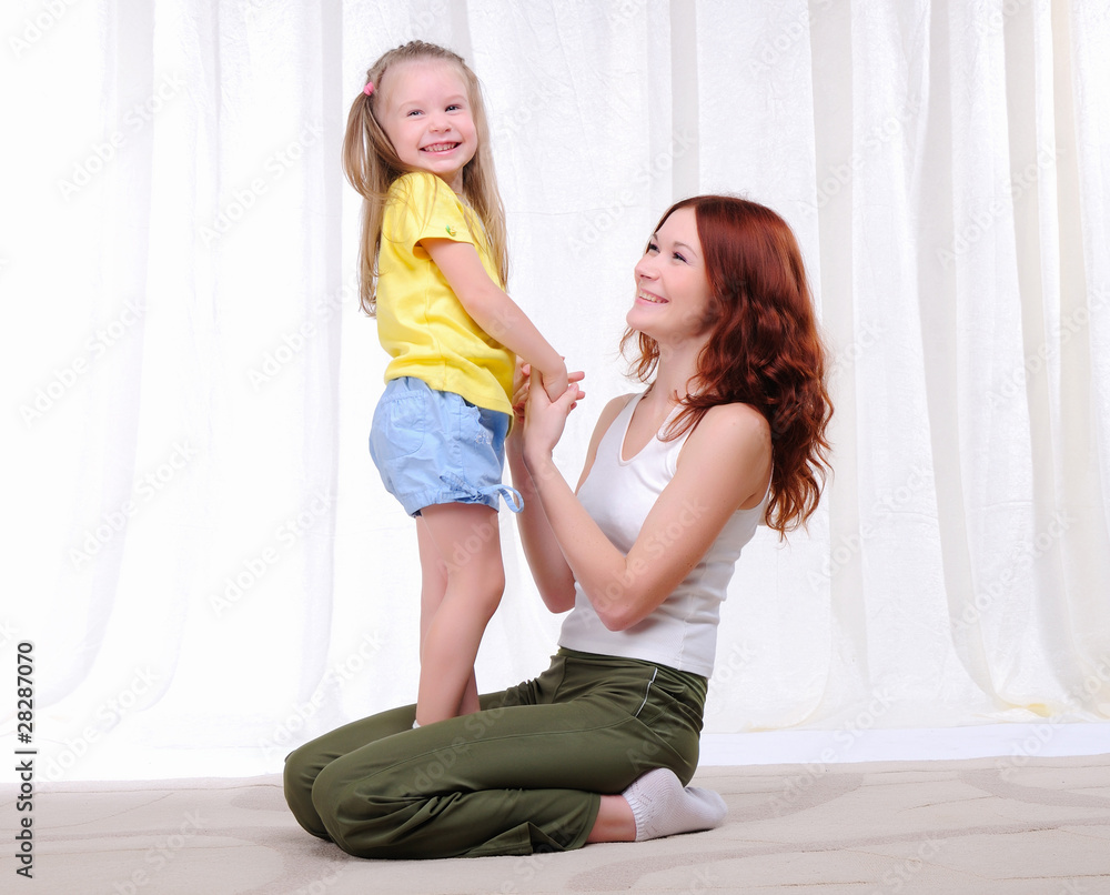 Young mother with her daughter Young mother with her daughter