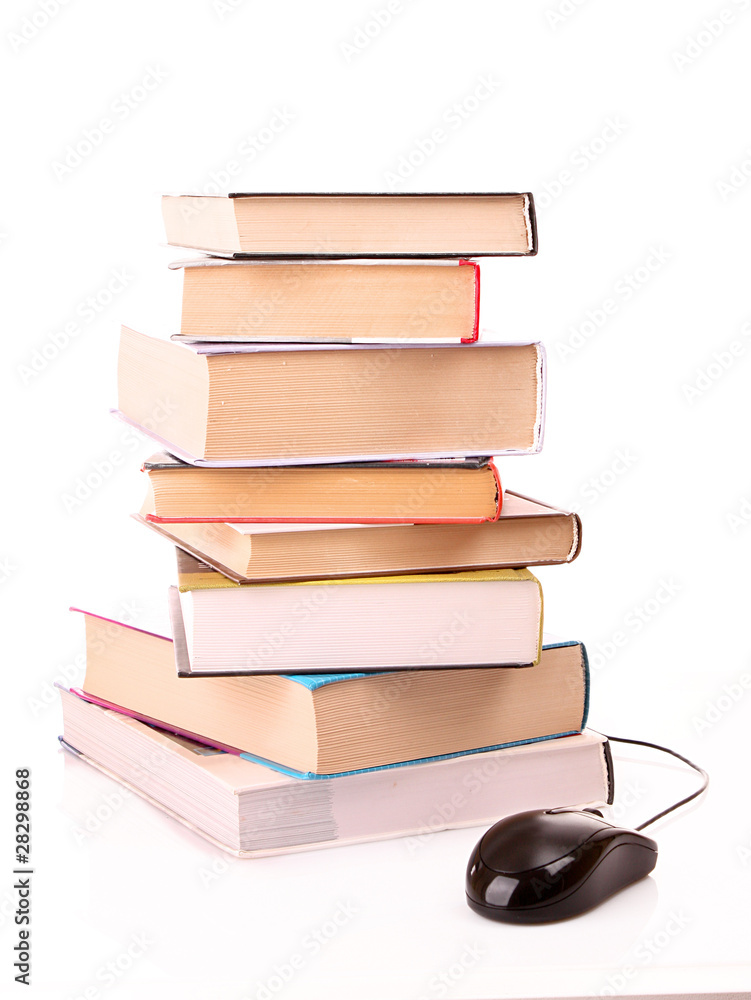 Hard cover books and computer mouse isolated on white Hard cover books and computer mouse isolated on white