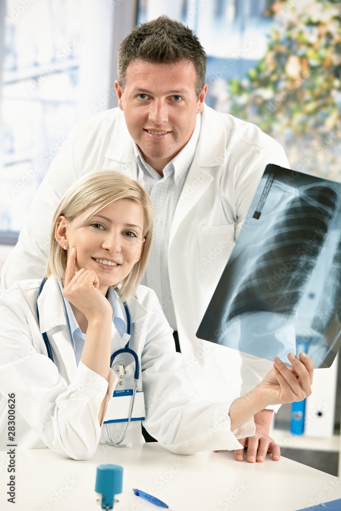 Portrait of medical doctors with x-ray image Portrait of medical doctors with x-ray image