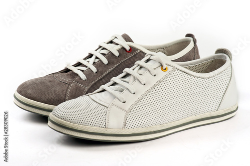 White and brown sports shoes on white background