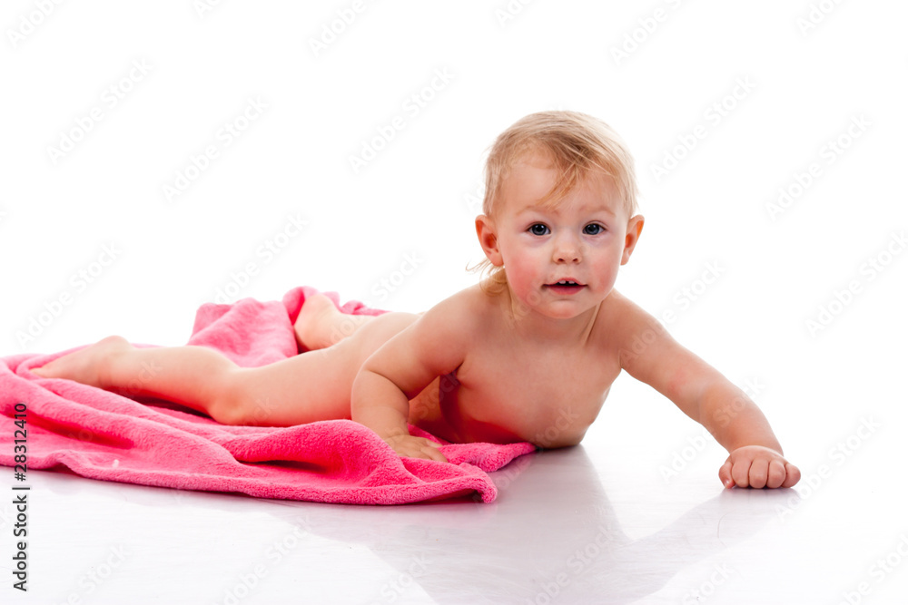 Beautiful girl curled on a pink blanket Beautiful girl curled on a pink blanket