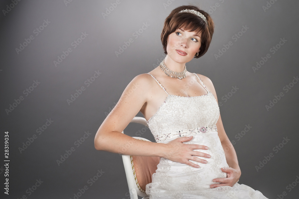 portrait of beautiful pregnant woman sitting on the chair portrait of beautiful pregnant woman sitting on the chair