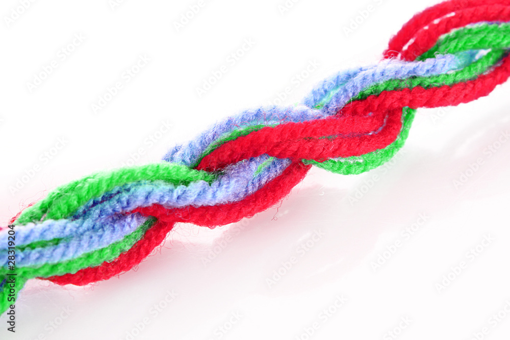 Twisted woolen coloured treads isolated on white Twisted woolen coloured treads isolated on white