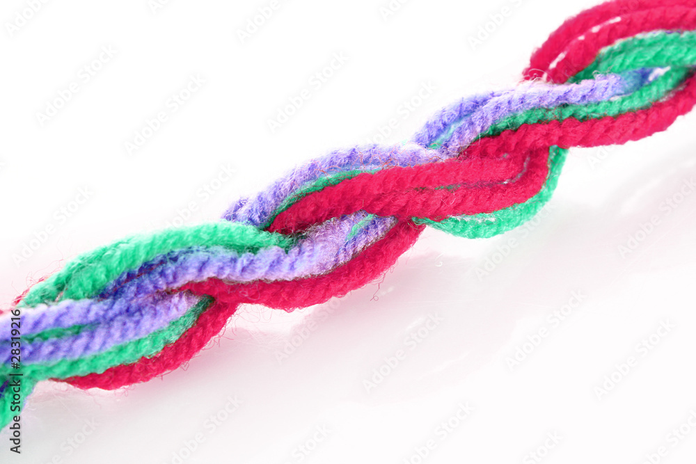 Twisted woolen coloured treads isolated on white Twisted woolen coloured treads isolated on white