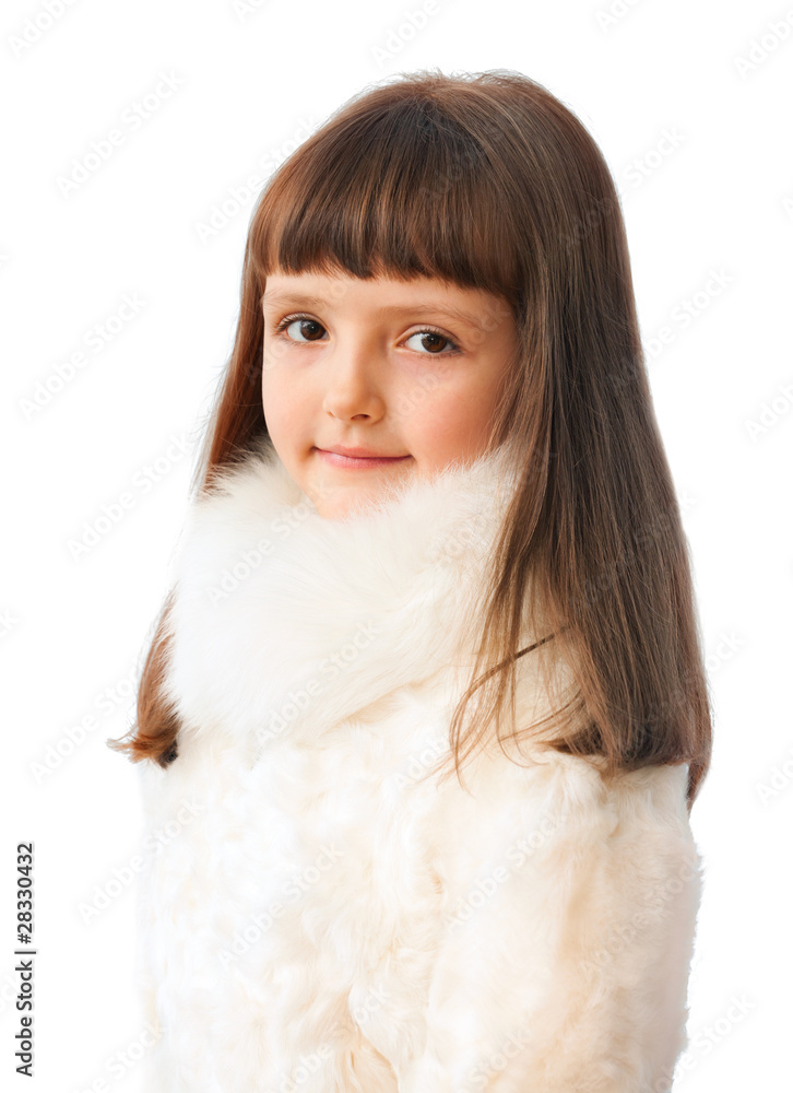 adorable seven years girl in fur coat isolated on white backgrou