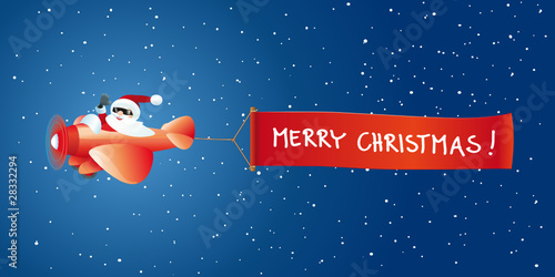 Weihnachtsmann im Flugzeug mit Banner