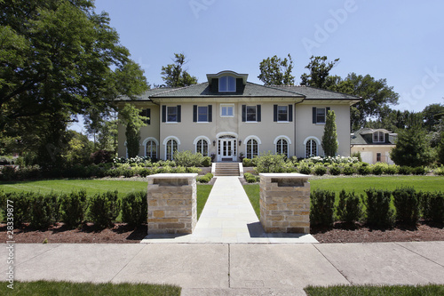 Luxury home with stone pillars