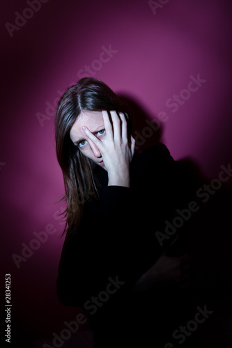 Young woman suffering from a severe depression/anxiety (color to
