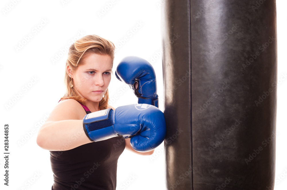 girl beats a boxing bag