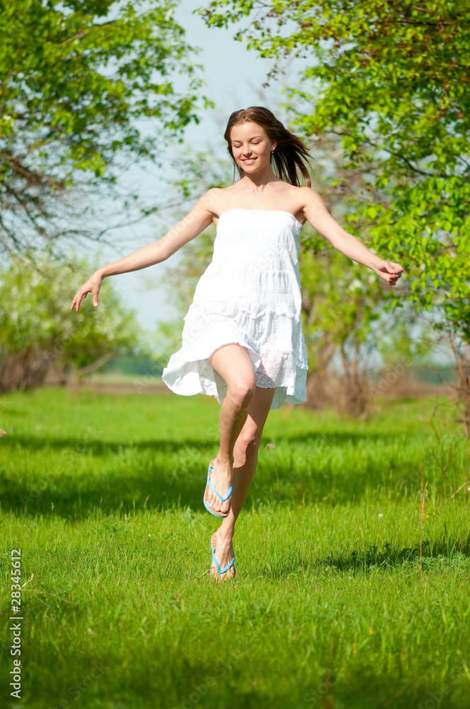 Beautiful young woman in apple tree garden Beautiful young woman in apple tree garden