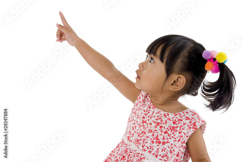 little girl pointing at something