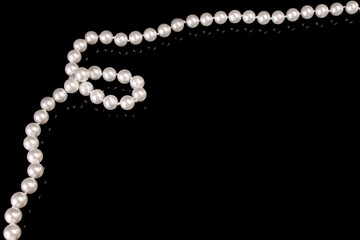 White pearls on  black  background