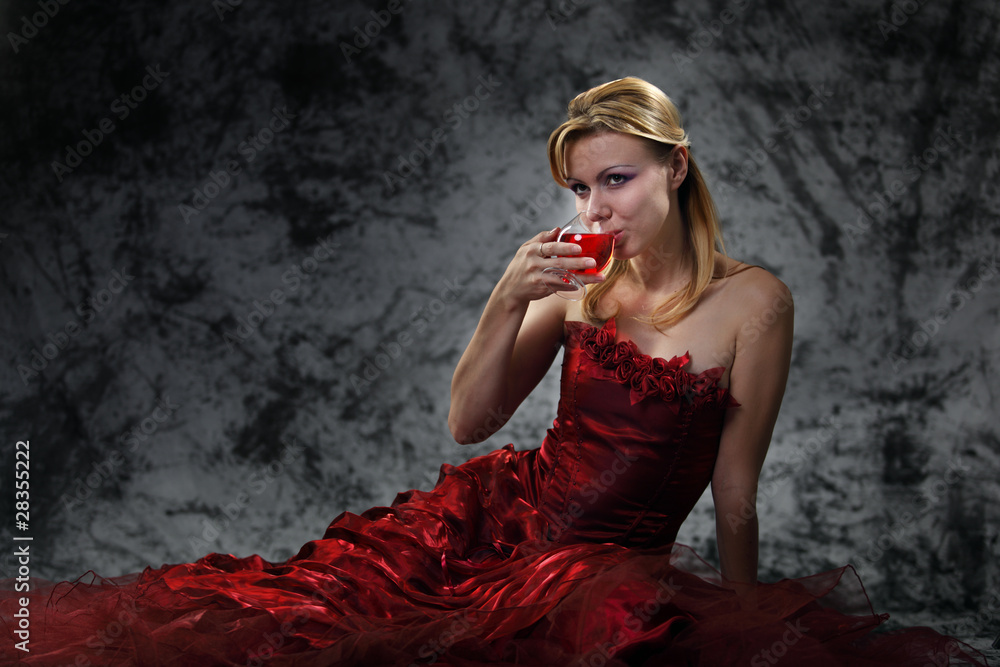 Naklejka premium The girl with a wine glass
