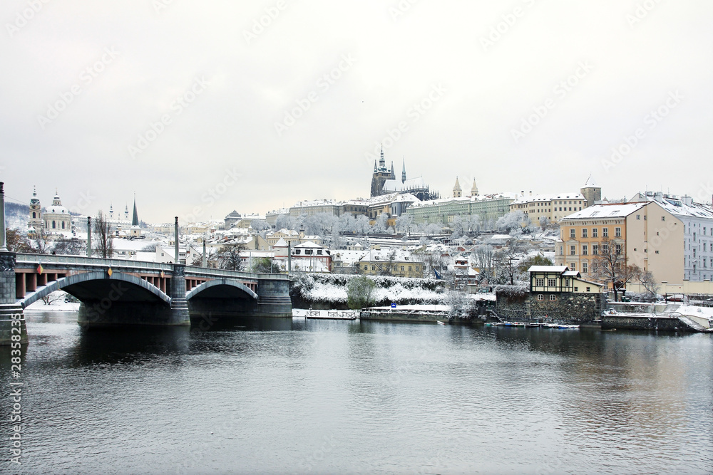 First Snow in Prague, gothic Castle above the River Vltava