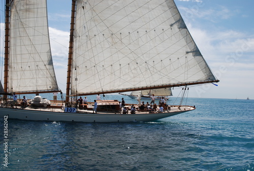 classic wood yacht under full sail