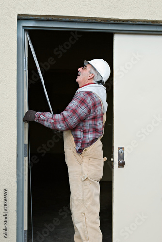 Worker Measuring Door © lawcain