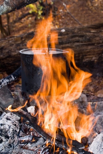 black touristic cauldron in a fire