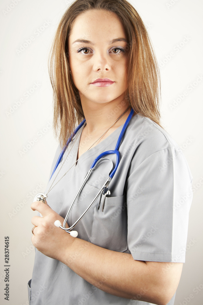 young woman doctor or nurse wearing scrubs young woman doctor or nurse wearing scrubs