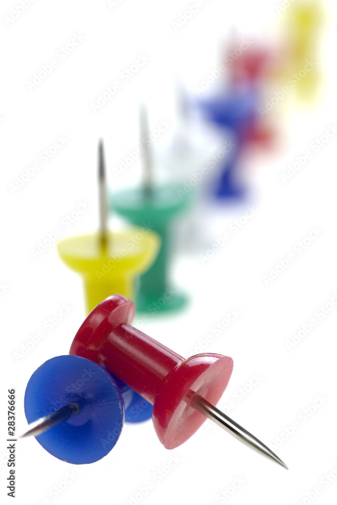 multicolored pushpins isolated on a white background multicolored pushpins isolated on a white background