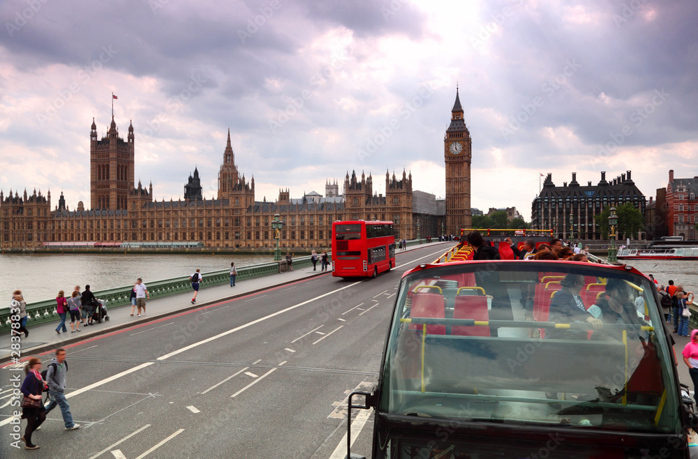 Travel red double-decker buses on Westminster bridge in London