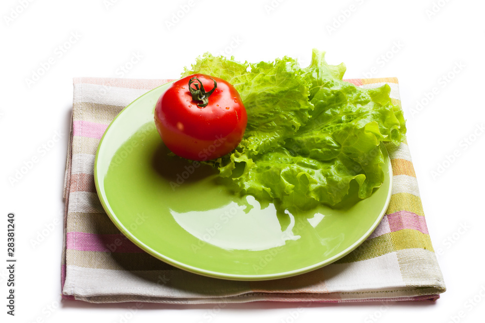 tomato and lettuce on a dish tomato and lettuce on a dish
