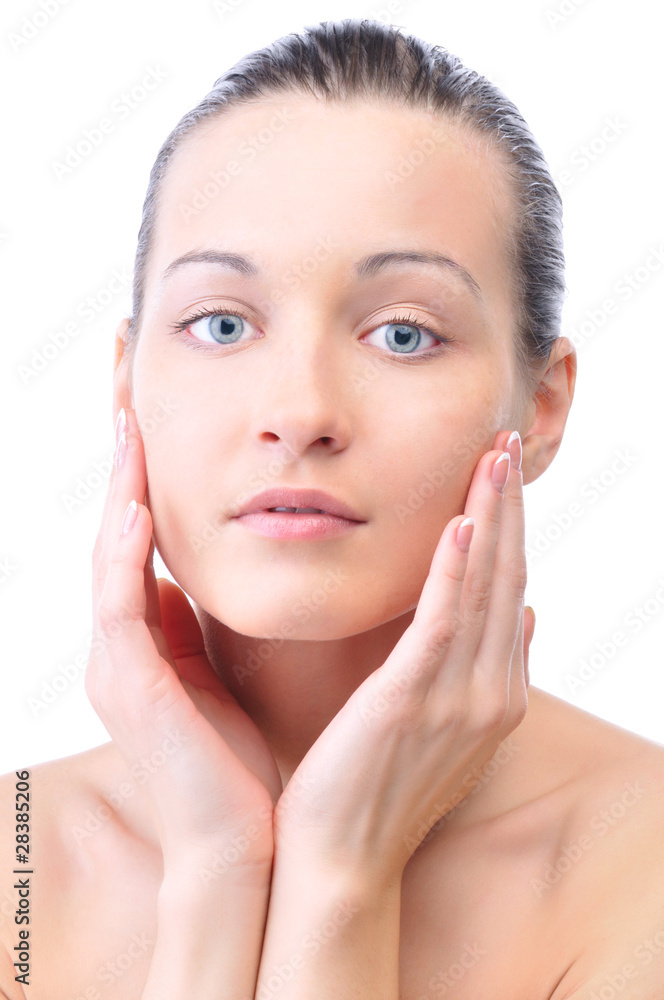 happy beautiful woman is touching her face and looking at camera