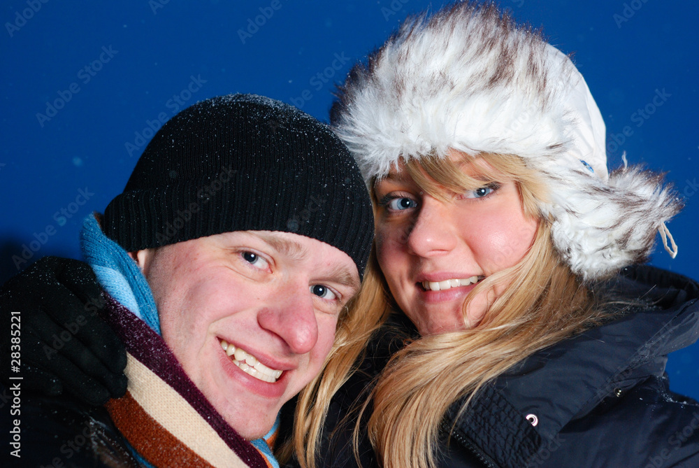 happy young couple at winter evening