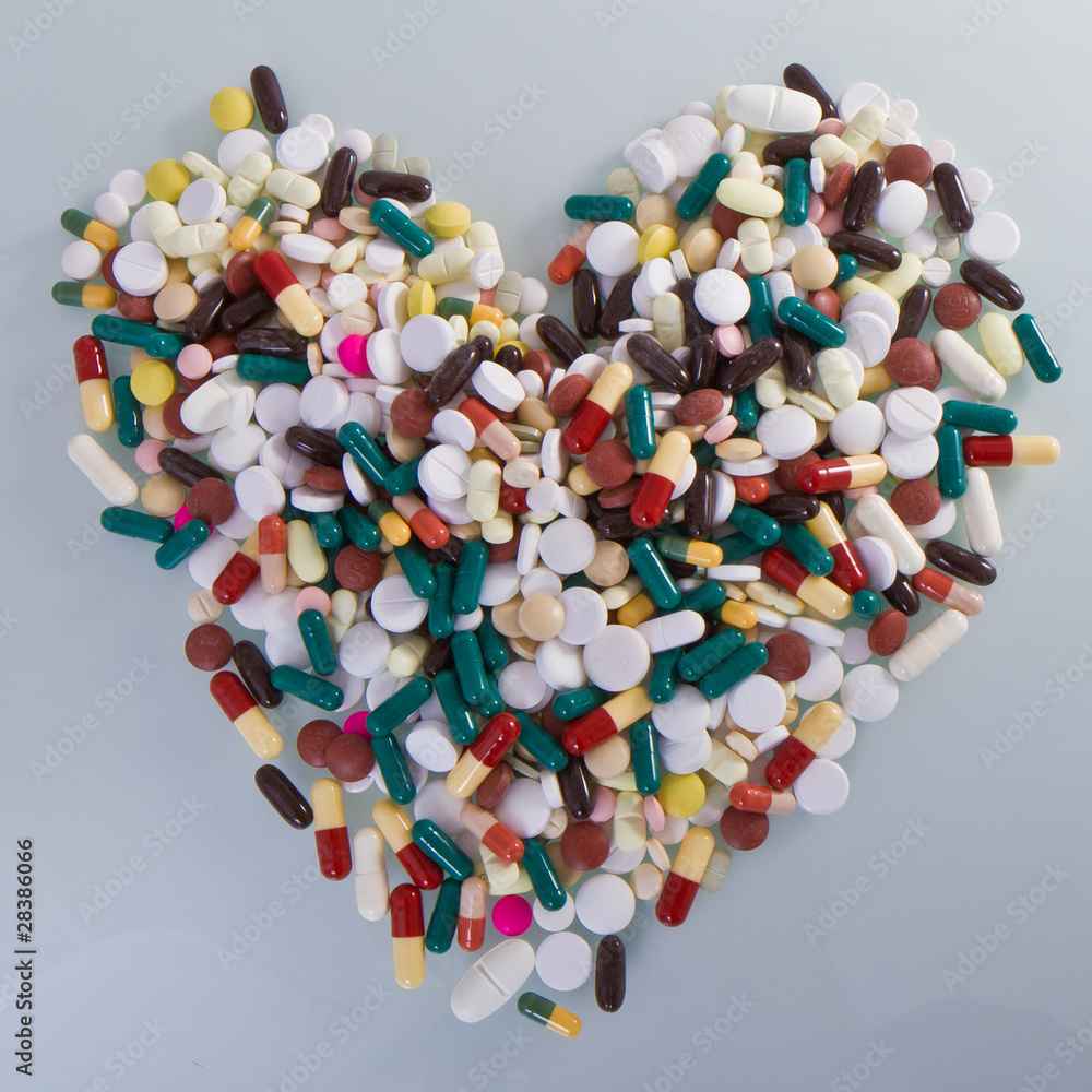 various pills in a shape of heart various pills in a shape of heart