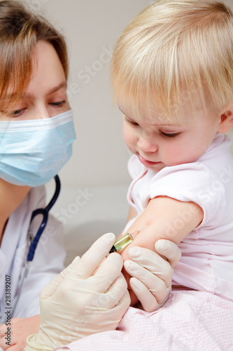 Little baby girl gets an injection