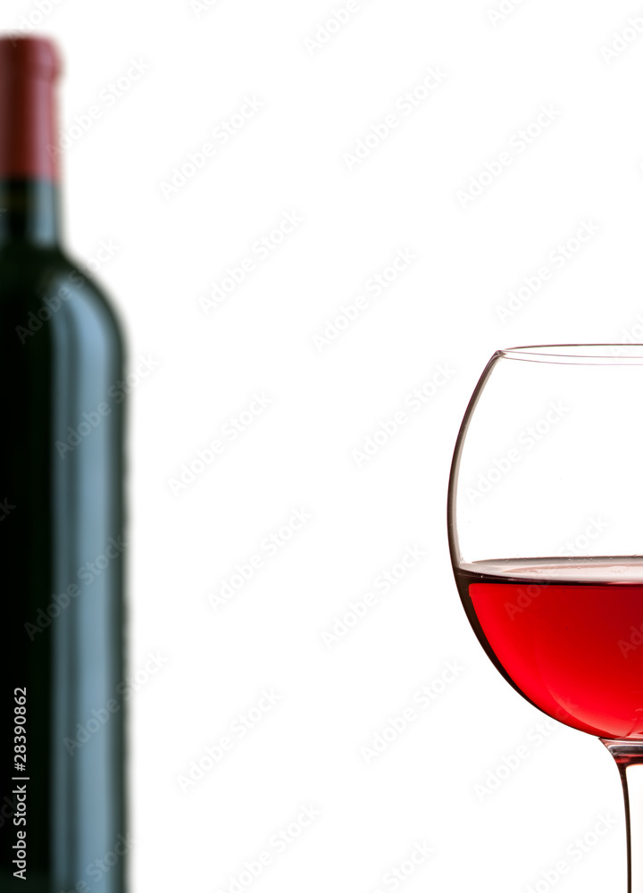 Glass of red wine and a bottle Glass of red wine and a bottle